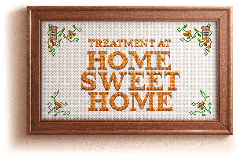 Framed cross stitch that reads Home Sweet Home